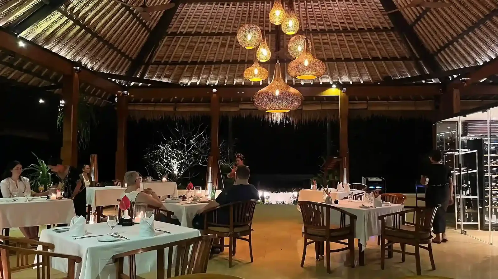 Open-air restaurant under a traditional alang-alang roof